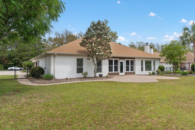 7008 Turnberry Cir, Navarre, FL 32566 - back of property featuring a yard, a chimney, a patio area, and fence