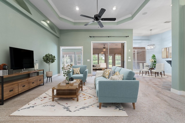 7008 Turnberry Cir, Navarre, FL 32566 - carpeted living area featuring baseboards, recessed lighting, crown molding, and a tray ceiling