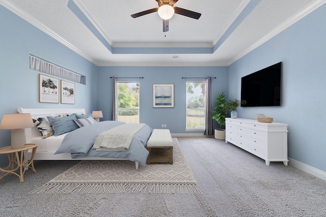 7008 Turnberry Cir, Navarre, FL 32566 - bedroom with crown molding, a ceiling fan, carpet floors, and a tray ceiling
