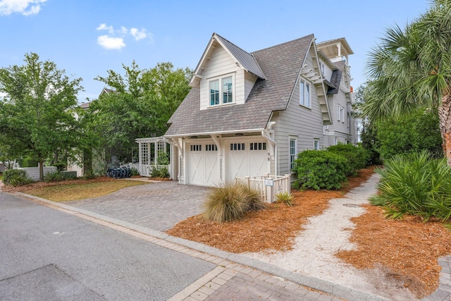 98 Compass Point Way, Inlet Beach, FL 32461 - view of side of property with decorative driveway and a garage