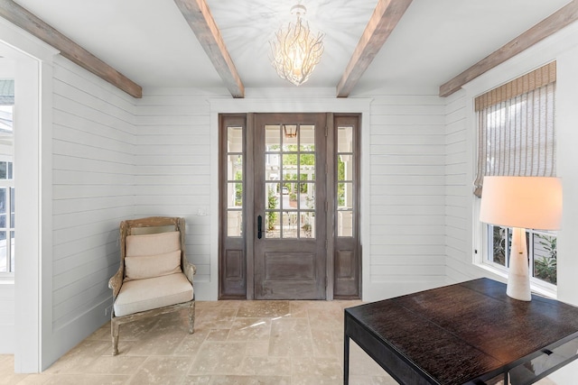 98 Compass Point Way, Inlet Beach, FL 32461 - foyer with wood walls, beamed ceiling, and a chandelier