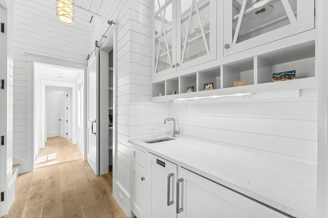 98 Compass Point Way, Inlet Beach, FL 32461 - indoor wet bar featuring a barn door and light wood finished floors