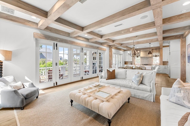 98 Compass Point Way, Inlet Beach, FL 32461 - living room featuring coffered ceiling, a chandelier, beam ceiling, recessed lighting, and french doors
