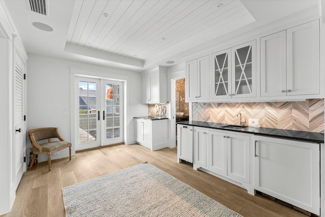 98 Compass Point Way, Inlet Beach, FL 32461 - kitchen featuring a raised ceiling, a sink, light wood-style floors, french doors, and wood ceiling