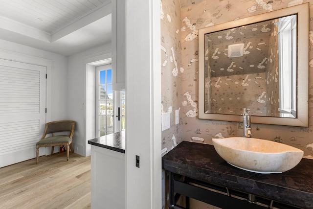 98 Compass Point Way, Inlet Beach, FL 32461 - bathroom with wallpapered walls, wood finished floors, vanity, and ornamental molding