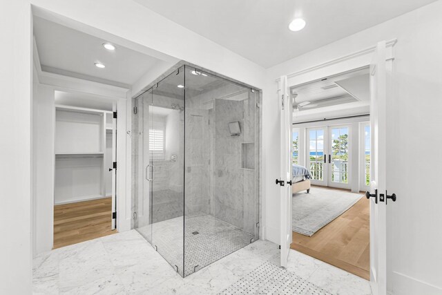 98 Compass Point Way, Inlet Beach, FL 32461 - ensuite bathroom featuring french doors, recessed lighting, a stall shower, a spacious closet, and baseboards