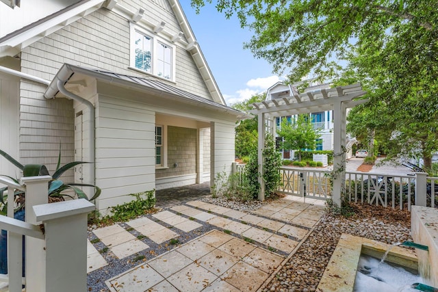 98 Compass Point Way, Inlet Beach, FL 32461 - view of side of property featuring a pergola, a patio area, fence, and a gate