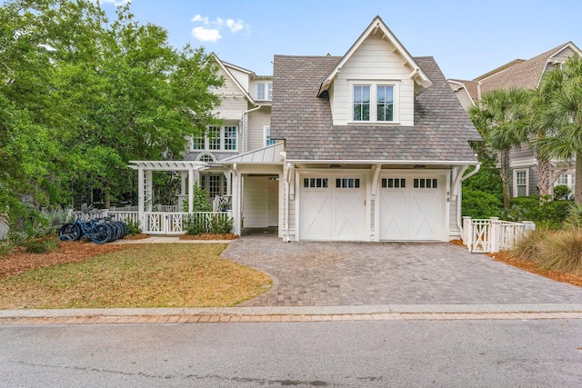98 Compass Point Way, Inlet Beach, FL 32461 - view of front of home featuring decorative driveway, an attached garage, fence, and a pergola