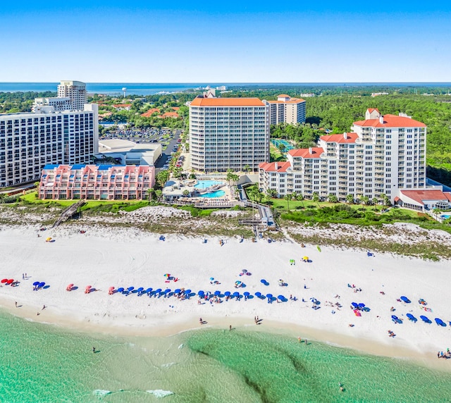 birds eye view of property featuring a water view and a view of the beach