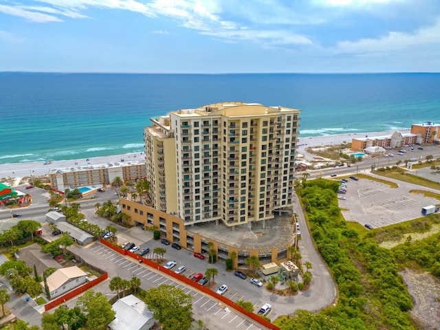 drone / aerial view featuring a view of the beach and a water view