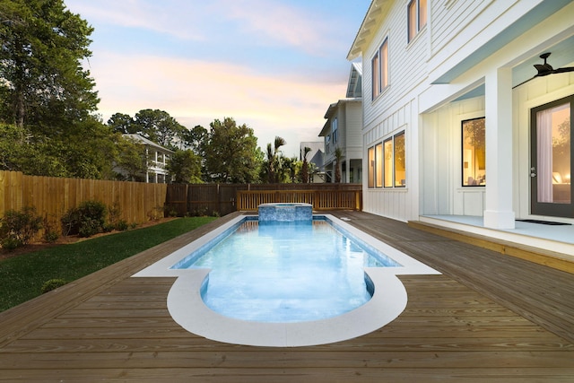 144 Dalton Dr, Santa Rosa Beach, FL 32459 - view of swimming pool with a pool with connected hot tub, a deck, and a fenced backyard
