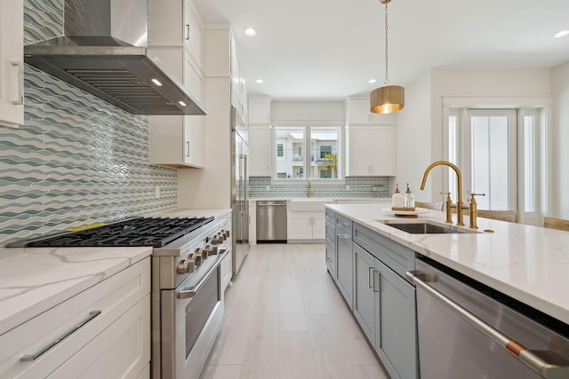 144 Dalton Dr, Santa Rosa Beach, FL 32459 - kitchen featuring tasteful backsplash, a sink, stainless steel appliances, recessed lighting, and wall chimney exhaust hood