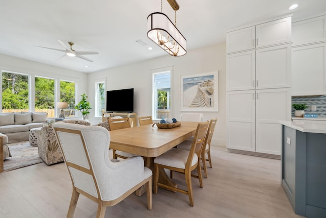 144 Dalton Dr, Santa Rosa Beach, FL 32459 - dining area with visible vents, a healthy amount of sunlight, ceiling fan, and light wood-style flooring