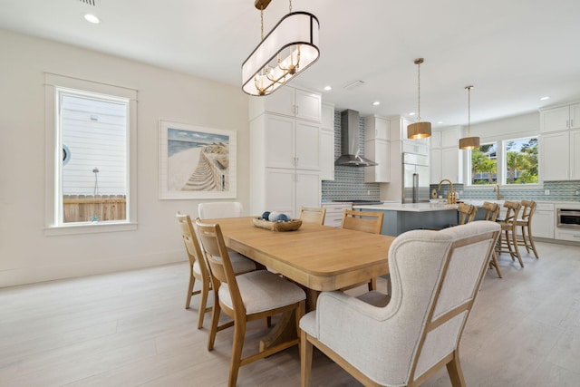 144 Dalton Dr, Santa Rosa Beach, FL 32459 - dining space featuring recessed lighting, light wood-style flooring, and baseboards