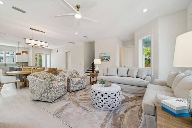 144 Dalton Dr, Santa Rosa Beach, FL 32459 - living area with recessed lighting, stairs, ceiling fan, light wood finished floors, and visible vents