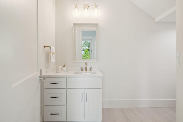 144 Dalton Dr, Santa Rosa Beach, FL 32459 - bathroom featuring baseboards, wood finished floors, and vanity