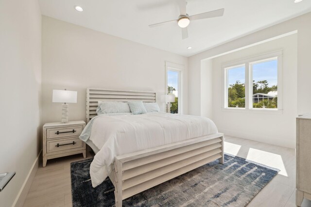 144 Dalton Dr, Santa Rosa Beach, FL 32459 - bedroom with baseboards, recessed lighting, a ceiling fan, and light wood-style floors