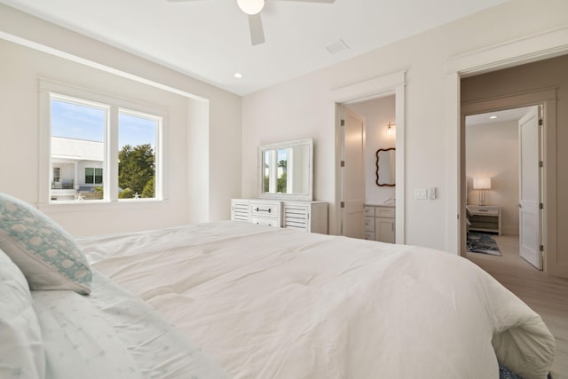 144 Dalton Dr, Santa Rosa Beach, FL 32459 - bedroom with recessed lighting, wood finished floors, connected bathroom, and multiple windows