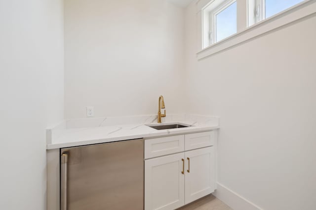 144 Dalton Dr, Santa Rosa Beach, FL 32459 - bar with fridge, baseboards, and a sink