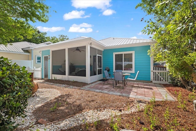 back of house with a patio, fence, a ceiling fan, and a sunroom
