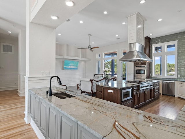 182 My Way, Santa Rosa Beach, FL 32459 - kitchen featuring a sink, light wood finished floors, a ceiling fan, and stainless steel appliances