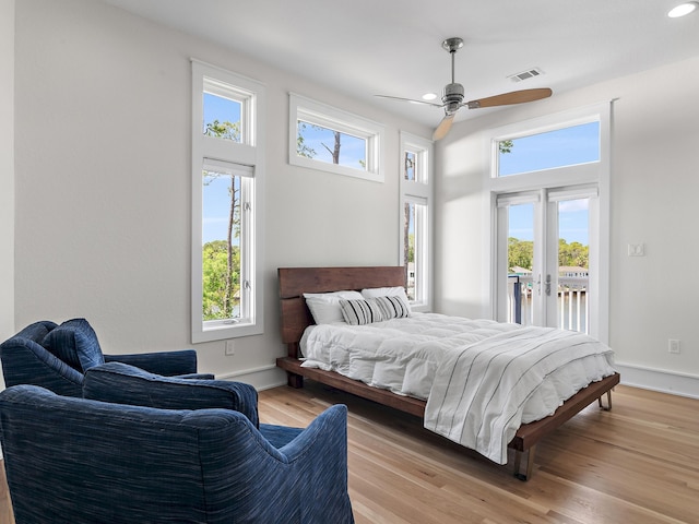 182 My Way, Santa Rosa Beach, FL 32459 - bedroom with multiple windows, access to exterior, light wood-type flooring, and visible vents