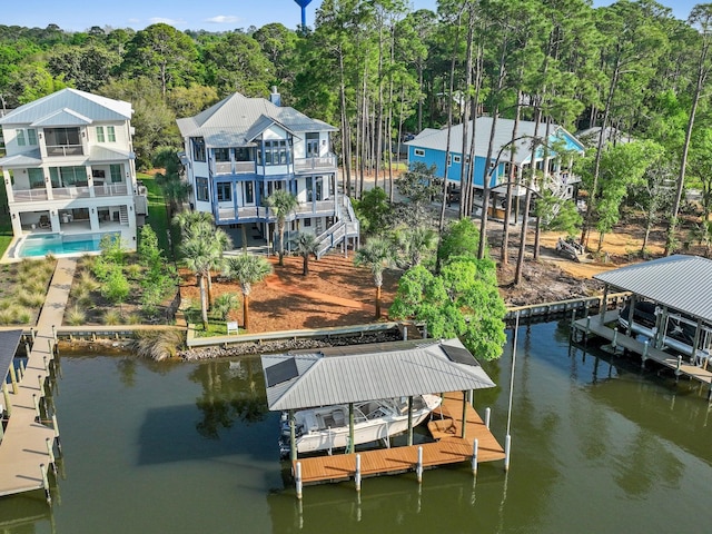 182 My Way, Santa Rosa Beach, FL 32459 - view of dock featuring a water view, a view of trees, a balcony, and boat lift