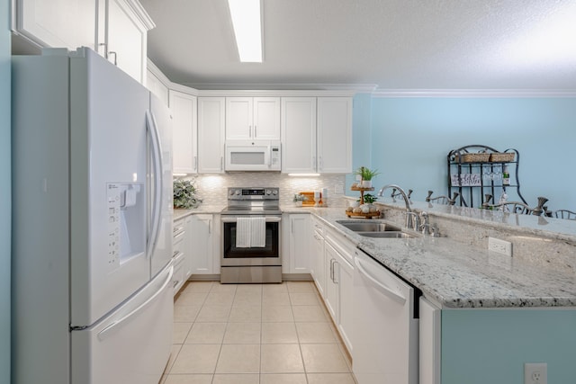 17545 Front Beach Rd Unit 1507, Panama City Beach, FL 32413 - kitchen with white appliances, a peninsula, light tile patterned flooring, crown molding, and decorative backsplash