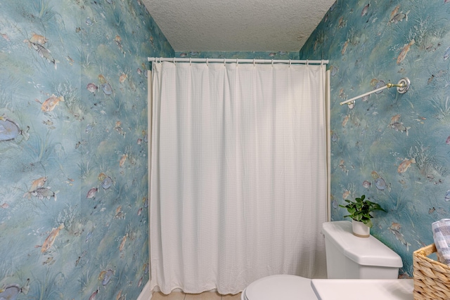 17545 Front Beach Rd Unit 1507, Panama City Beach, FL 32413 - bathroom with a shower with curtain, wallpapered walls, and a textured ceiling