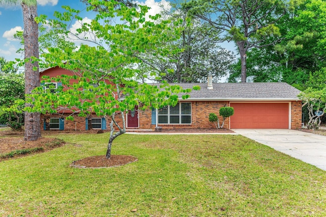 11 Birch Ave, Shalimar, FL 32579 - view of front of house featuring concrete driveway, a front lawn, an attached garage, and brick siding