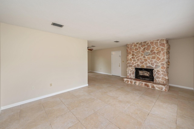 11 Birch Ave, Shalimar, FL 32579 - unfurnished living room featuring light tile patterned floors, visible vents, baseboards, and a fireplace