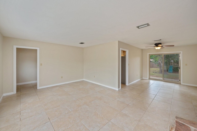 11 Birch Ave, Shalimar, FL 32579 - empty room featuring baseboards, visible vents, light tile patterned floors, and a ceiling fan