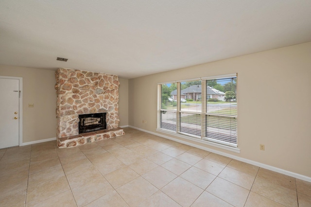 11 Birch Ave, Shalimar, FL 32579 - unfurnished living room featuring a fireplace, light tile patterned floors, visible vents, and baseboards