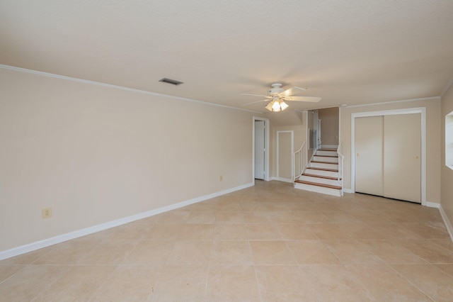 11 Birch Ave, Shalimar, FL 32579 - empty room with stairway, visible vents, ceiling fan, baseboards, and ornamental molding