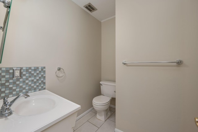 11 Birch Ave, Shalimar, FL 32579 - half bath featuring visible vents, baseboards, toilet, vanity, and tile patterned flooring