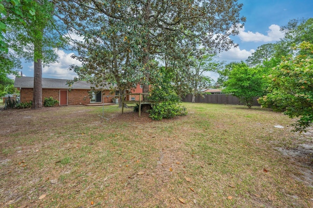11 Birch Ave, Shalimar, FL 32579 - view of yard featuring a deck and fence