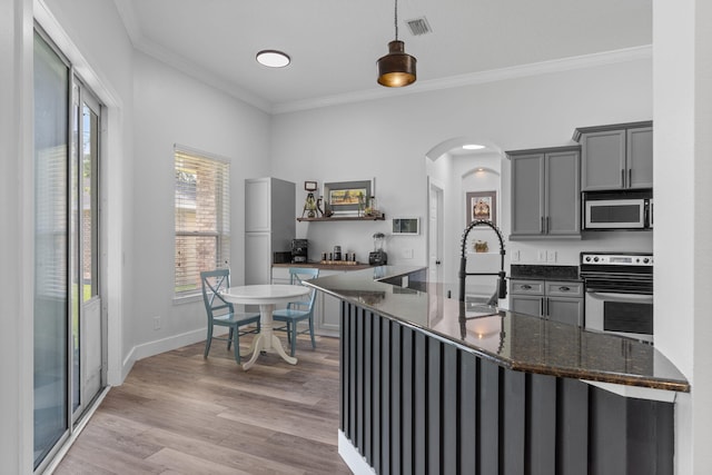 129 Red Maple Way, Niceville, FL 32578 - kitchen featuring stainless steel electric stove, gray cabinetry, ornamental molding, arched walkways, and light wood-style flooring