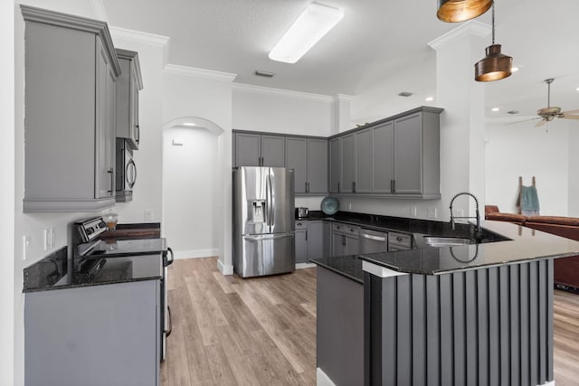 129 Red Maple Way, Niceville, FL 32578 - kitchen with stainless steel appliances, gray cabinets, dark stone counters, a ceiling fan, and ornamental molding