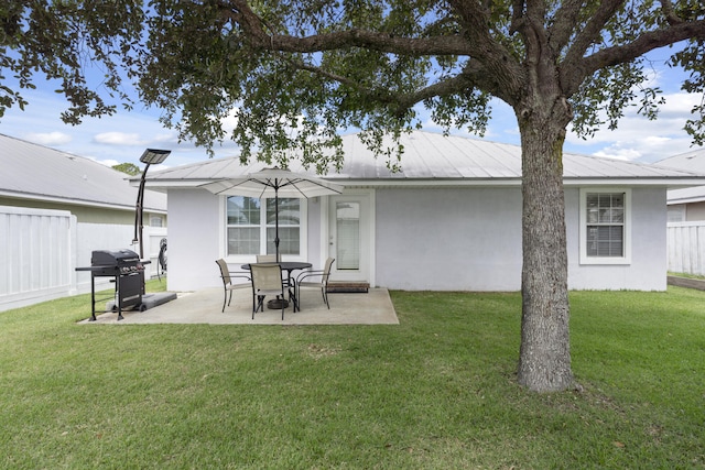 119 Red Bay Ct, Santa Rosa Beach, FL 32459 - rear view of house with stucco siding, a patio area, and metal roof