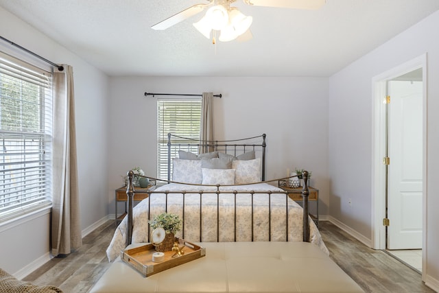 119 Red Bay Ct, Santa Rosa Beach, FL 32459 - bedroom featuring wood finished floors, baseboards, and a ceiling fan