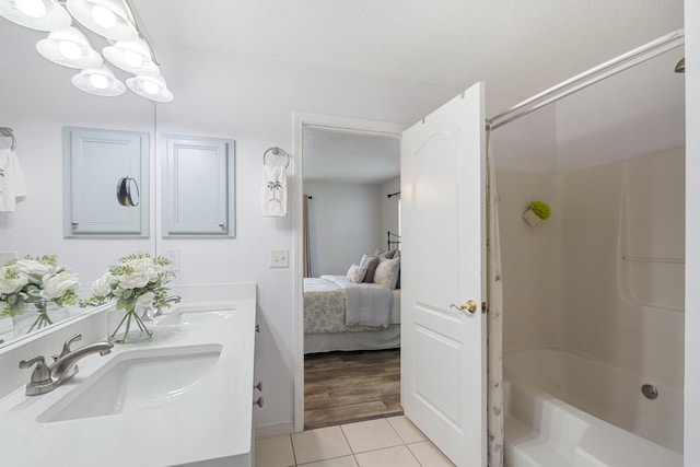 119 Red Bay Ct, Santa Rosa Beach, FL 32459 - ensuite bathroom featuring tile patterned floors, double vanity, and shower / tub combination