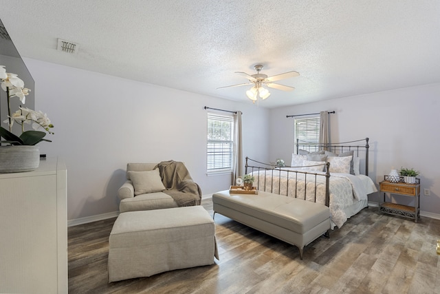 119 Red Bay Ct, Santa Rosa Beach, FL 32459 - bedroom with wood finished floors, a textured ceiling, ceiling fan, and baseboards