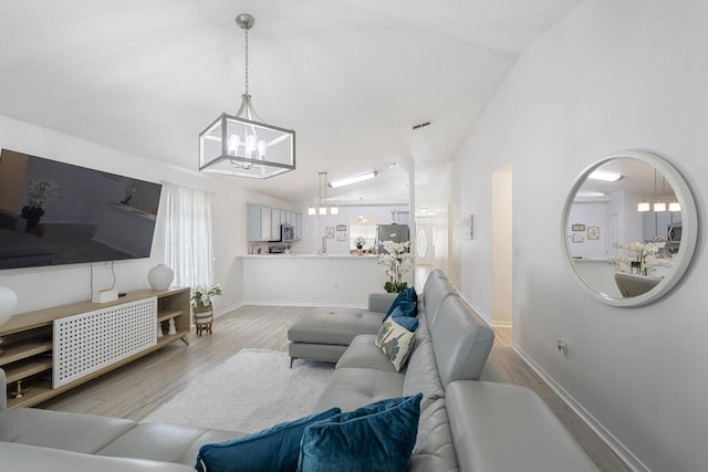 119 Red Bay Ct, Santa Rosa Beach, FL 32459 - living area featuring a chandelier, wood finished floors, and baseboards