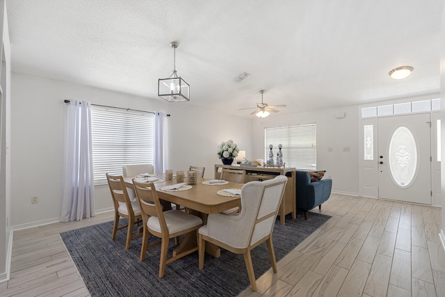 119 Red Bay Ct, Santa Rosa Beach, FL 32459 - dining room with light wood-style flooring, baseboards, and ceiling fan