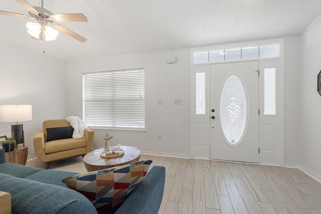 119 Red Bay Ct, Santa Rosa Beach, FL 32459 - foyer entrance featuring light wood-style floors, baseboards, and ceiling fan