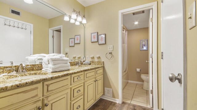 520 N Richard Jackson Blvd Unit 952, Panama City Beach, FL 32407 - full bath with double vanity, visible vents, toilet, and a sink