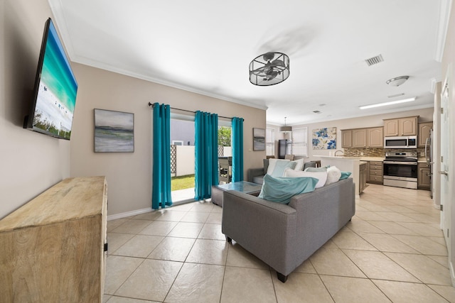 229 Inverrary Dr, Destin, FL 32541 - living area featuring crown molding, baseboards, light tile patterned flooring, and visible vents