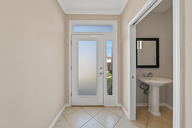 229 Inverrary Dr, Destin, FL 32541 - doorway to outside featuring crown molding, light tile patterned flooring, baseboards, and a wealth of natural light