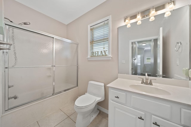 229 Inverrary Dr, Destin, FL 32541 - full bath with tile patterned flooring, bath / shower combo with glass door, baseboards, vanity, and toilet