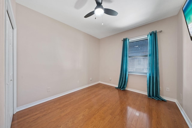 229 Inverrary Dr, Destin, FL 32541 - empty room featuring baseboards, ceiling fan, and wood finished floors